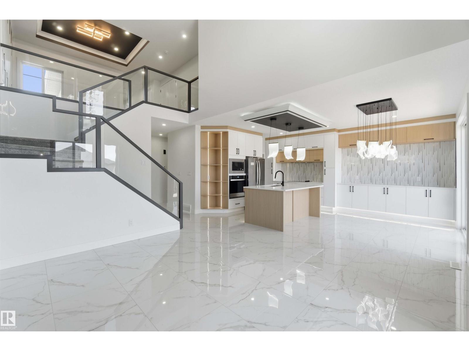 Kitchen island beneath open staircase